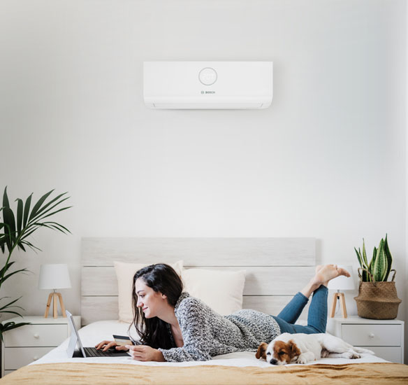A woman learning about energy solutions on her computer.
